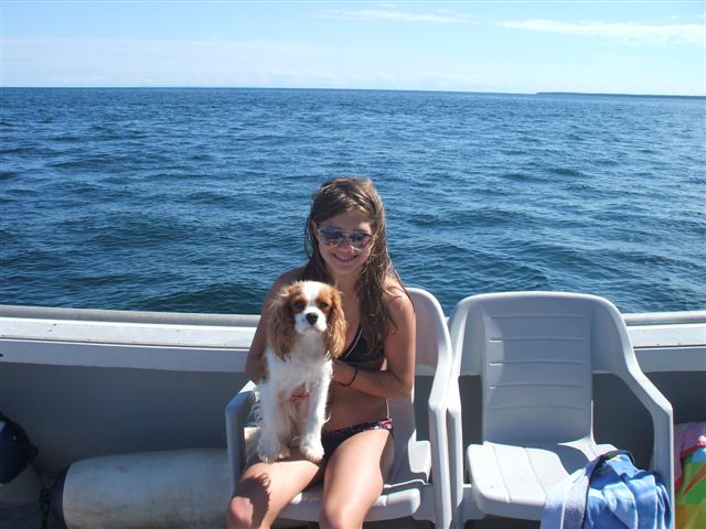 Caleigh out in our boat sitting with my neice.  She just loves the boat.